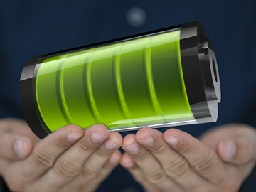 Hände halten neon-grünes Element Hände halten neon-grünes Element